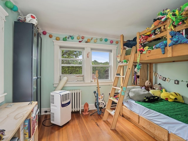 58 Riverdale Ave, Greenwich, CT 06831 - bedroom featuring radiator and wood finished floors