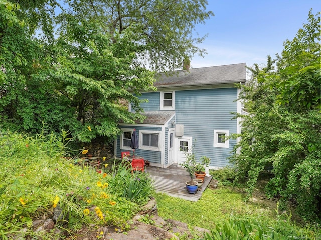 58 Riverdale Ave, Greenwich, CT 06831 - rear view of property with a deck and roof with shingles