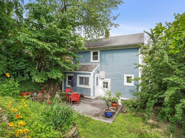 58 Riverdale Ave, Greenwich, CT 06831 - rear view of house featuring a deck and a chimney