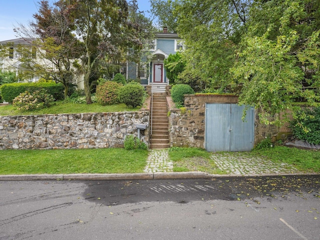 58 Riverdale Ave, Greenwich, CT 06831 - view of front of property with a chimney and a front yard