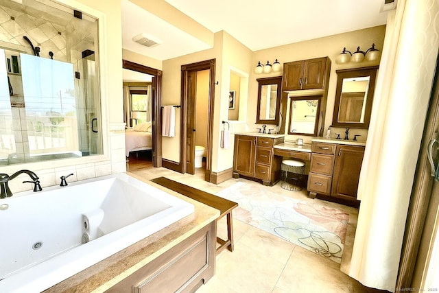 19 Prospect Hill Rd, Groton, CT 06340 - ensuite bathroom with a shower stall, vanity, a jetted tub, and tile patterned flooring