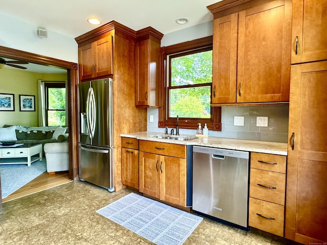 19 Prospect Hill Rd, Groton, CT 06340 - kitchen with appliances with stainless steel finishes, healthy amount of natural light, tasteful backsplash, brown cabinetry, and recessed lighting