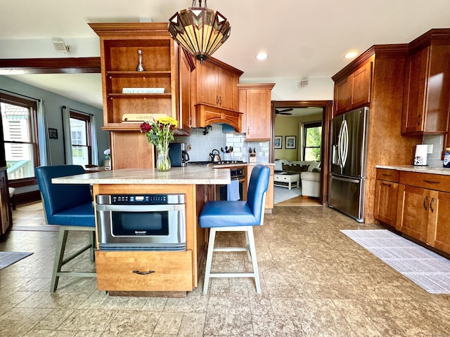19 Prospect Hill Rd, Groton, CT 06340 - kitchen with stainless steel appliances, a kitchen breakfast bar, tasteful backsplash, open shelves, and recessed lighting