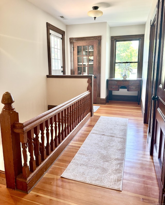 19 Prospect Hill Rd, Groton, CT 06340 - corridor with healthy amount of natural light, wood finished floors, and an upstairs landing