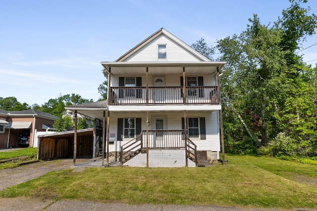 112 French St, Torrington, CT 06790 - view of front of property featuring a porch, a balcony, a front lawn, and asphalt driveway