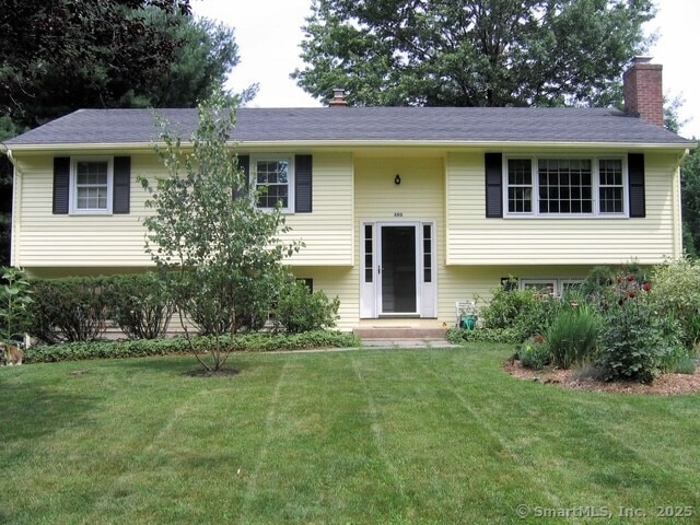 480 Budding Ridge Rd, Cheshire, CT 06410 - split foyer home featuring a chimney and a front lawn