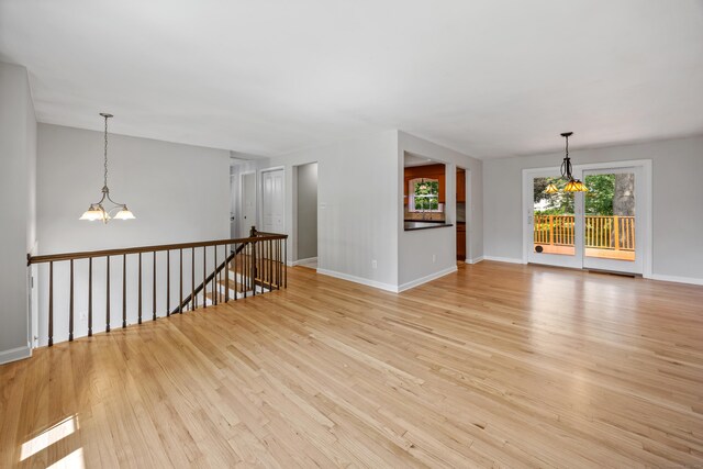 480 Budding Ridge Rd, Cheshire, CT 06410 - spare room with a chandelier and light wood-style flooring