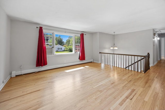 480 Budding Ridge Rd, Cheshire, CT 06410 - unfurnished room featuring a baseboard heating unit, wood finished floors, a chandelier, and cooling unit