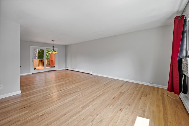 480 Budding Ridge Rd, Cheshire, CT 06410 - empty room featuring baseboard heating, a chandelier, and light wood-style floors
