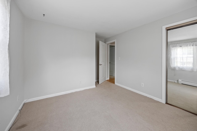 480 Budding Ridge Rd, Cheshire, CT 06410 - unfurnished bedroom featuring carpet floors, a closet, and a baseboard heating unit