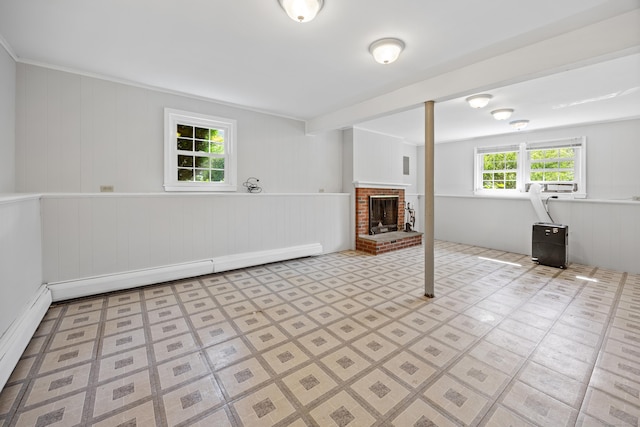 480 Budding Ridge Rd, Cheshire, CT 06410 - unfurnished living room with a baseboard radiator, a fireplace, baseboard heating, and wood walls