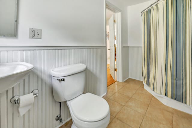 165 Booth Hill Rd, Trumbull, CT 06611 - full bath with a wainscoted wall, tile patterned flooring, and a shower with shower curtain