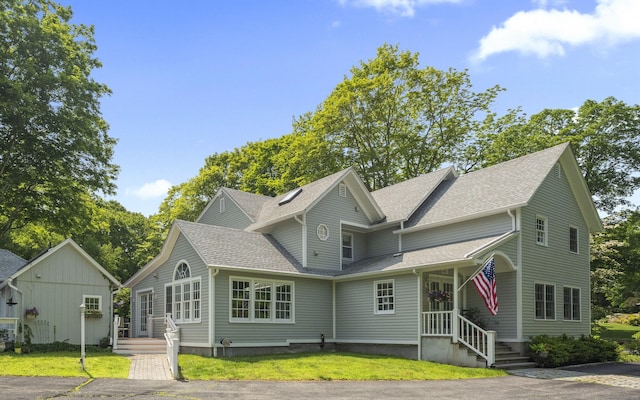 4 Johnny Cake Hill Rd, Old Lyme, CT 06371 - view of front of property featuring a front lawn and a shingled roof