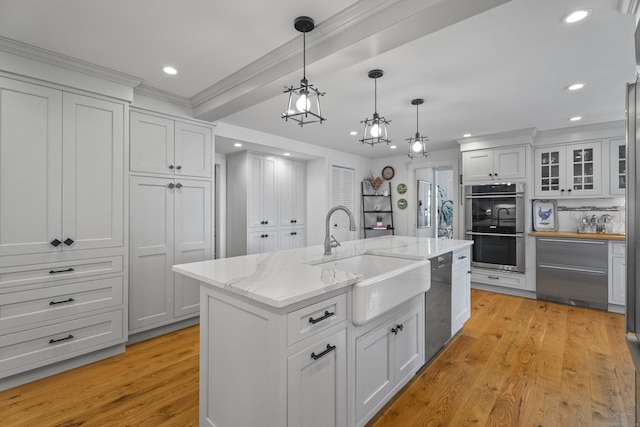 4 Johnny Cake Hill Rd, Old Lyme, CT 06371 - kitchen with appliances with stainless steel finishes, recessed lighting, white cabinets, an island with sink, and light wood finished floors