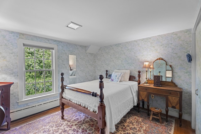 4 Johnny Cake Hill Rd, Old Lyme, CT 06371 - bedroom with a baseboard heating unit, wood finished floors, and wallpapered walls