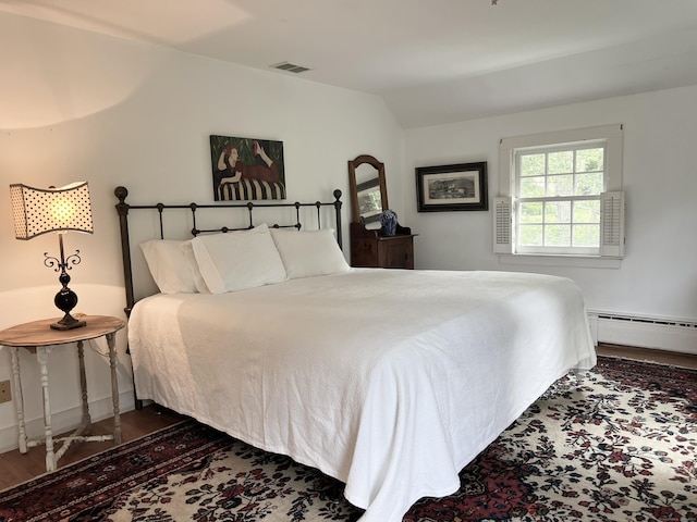 4 Johnny Cake Hill Rd, Old Lyme, CT 06371 - bedroom featuring baseboard heating, vaulted ceiling, and wood finished floors