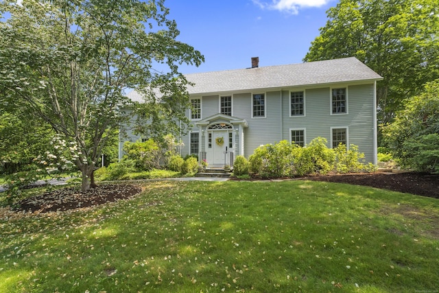 4 Johnny Cake Hill Rd, Old Lyme, CT 06371 - colonial inspired home featuring a front yard and a chimney