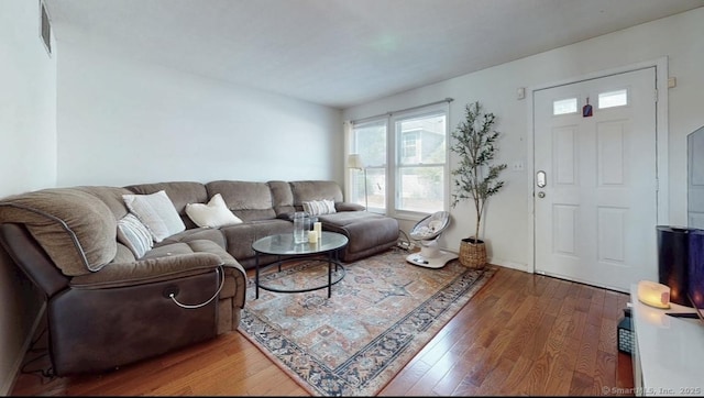 279 New Haven Ave Apt E, Milford, CT 06460 - living area featuring wood finished floors