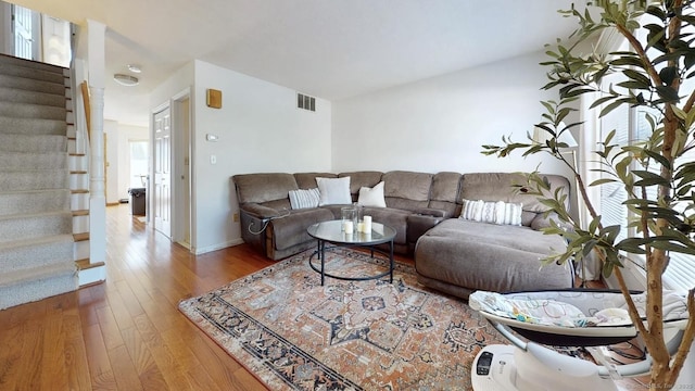 279 New Haven Ave Apt E, Milford, CT 06460 - living area with stairs and wood finished floors