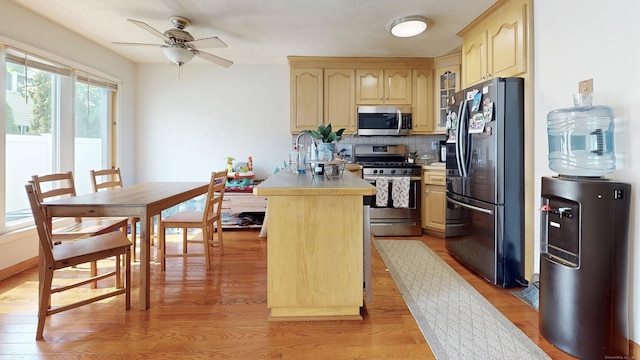279 New Haven Ave Apt E, Milford, CT 06460 - kitchen featuring stainless steel appliances, light brown cabinets, light wood-style floors, a ceiling fan, and light countertops