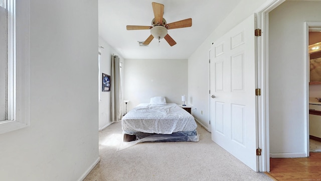 279 New Haven Ave Apt E, Milford, CT 06460 - carpeted bedroom featuring baseboards and ceiling fan