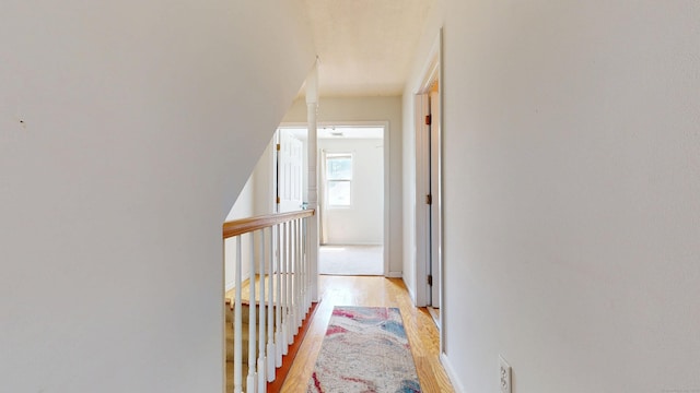 279 New Haven Ave Apt E, Milford, CT 06460 - hall featuring light wood-style flooring and an upstairs landing