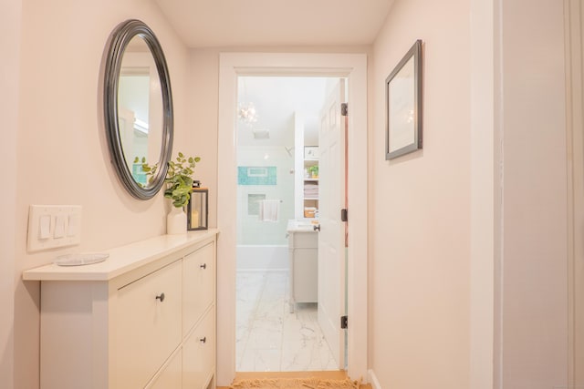 158 Stadley Rough Rd, Danbury, CT 06811 - hallway featuring light marble finish flooring and baseboards