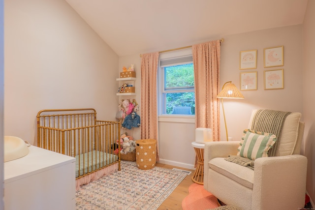 158 Stadley Rough Rd, Danbury, CT 06811 - bedroom featuring wood finished floors, a crib, and lofted ceiling