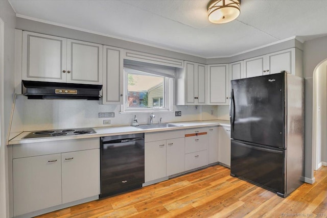 209 Roxbury Rd, New Britain, CT 06053 - kitchen featuring black appliances, under cabinet range hood, light countertops, crown molding, and light wood-style floors