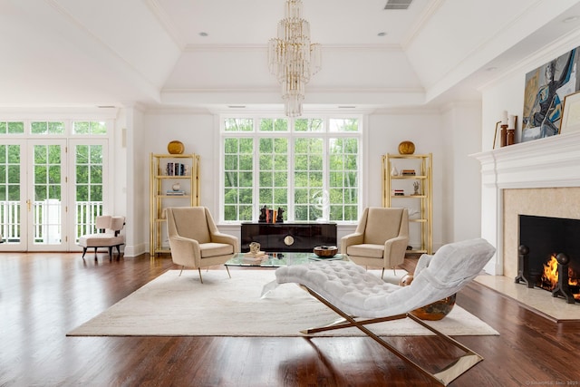 474 Ponus Rdg, New Canaan, CT 06840 - sitting room featuring healthy amount of natural light, a raised ceiling, a high end fireplace, and ornamental molding