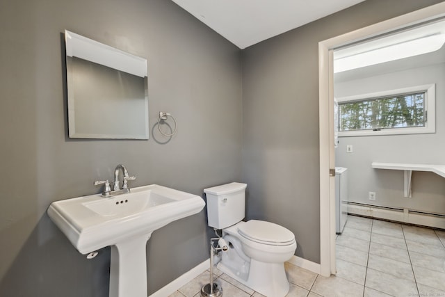 24 Quince Ct, Bristol, CT 06010 - half bathroom featuring a baseboard heating unit and tile patterned flooring