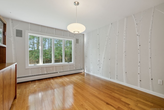 24 Quince Ct, Bristol, CT 06010 - spare room featuring a baseboard radiator and light wood finished floors