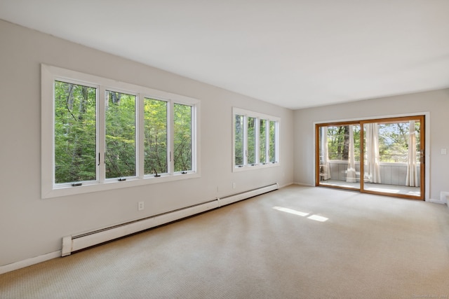24 Quince Ct, Bristol, CT 06010 - carpeted empty room featuring a baseboard heating unit and baseboards