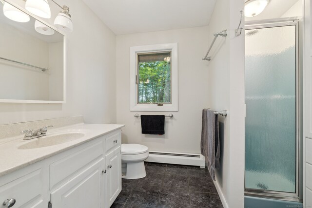 24 Quince Ct, Bristol, CT 06010 - bathroom with a baseboard heating unit, a stall shower, vanity, and tile patterned floors