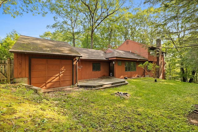 24 Quince Ct, Bristol, CT 06010 - back of house with a chimney, a garage, a wooden deck, and a shingled roof