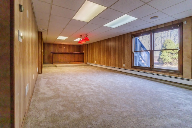 155 Melinda Ln, Bristol, CT 06010 - carpeted spare room with baseboard heating, wooden walls, a drop ceiling, and a bar