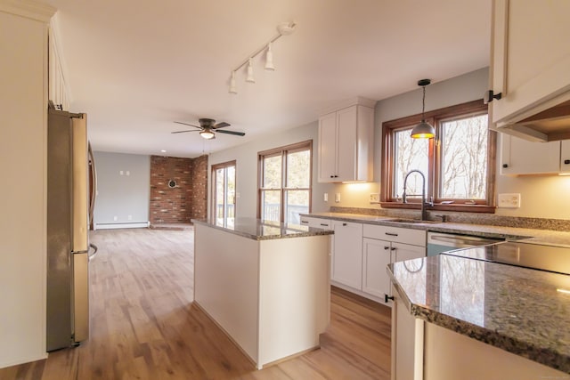 155 Melinda Ln, Bristol, CT 06010 - kitchen featuring freestanding refrigerator, a ceiling fan, light wood-type flooring, and a baseboard radiator