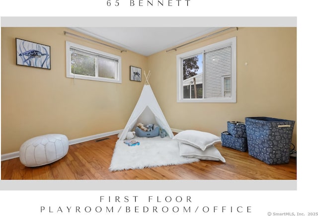 65 Bennett St, Fairfield, CT 06825 - game room with wood finished floors and healthy amount of natural light