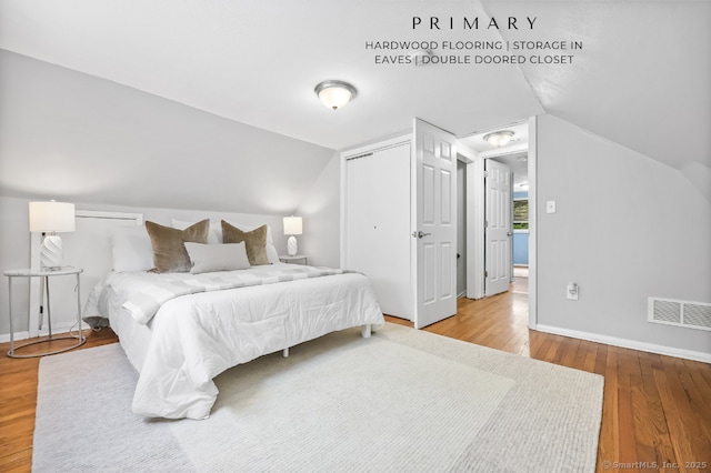 65 Bennett St, Fairfield, CT 06825 - bedroom featuring wood finished floors, vaulted ceiling, and a closet
