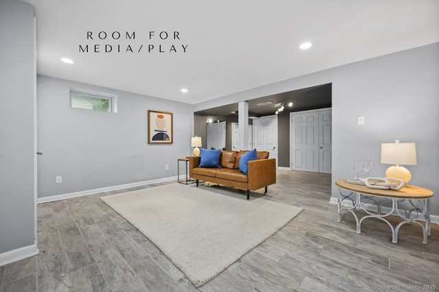 65 Bennett St, Fairfield, CT 06825 - living area with wood finished floors and recessed lighting