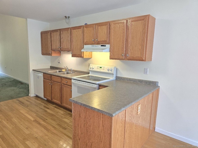 244 Oakland St Apt F, Manchester, CT 06042 - kitchen with under cabinet range hood, white appliances, light wood-style flooring, brown cabinets, and dark countertops