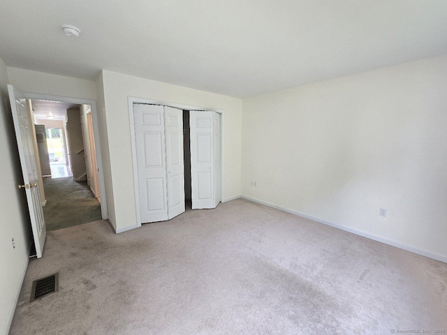 244 Oakland St Apt F, Manchester, CT 06042 - unfurnished bedroom featuring carpet flooring and a closet