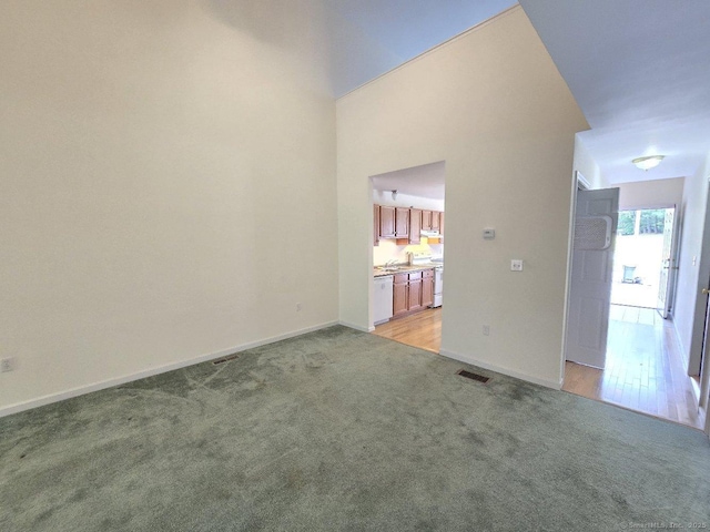 244 Oakland St Apt F, Manchester, CT 06042 - empty room featuring light colored carpet and baseboards