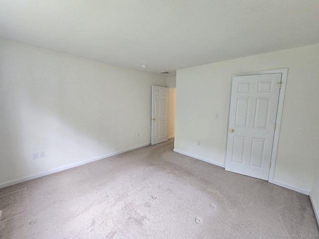 244 Oakland St Apt F, Manchester, CT 06042 - unfurnished bedroom with carpet floors and baseboards