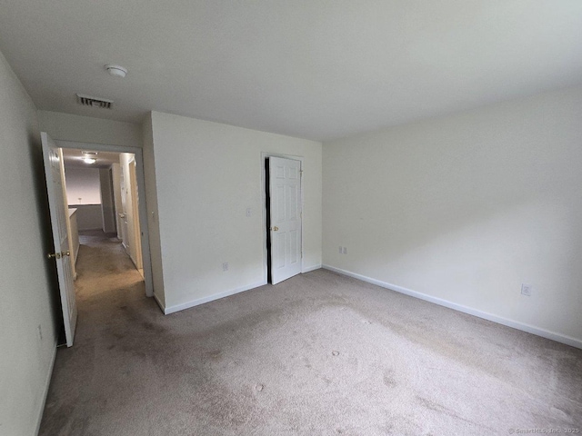 244 Oakland St Apt F, Manchester, CT 06042 - unfurnished bedroom with carpet and baseboards