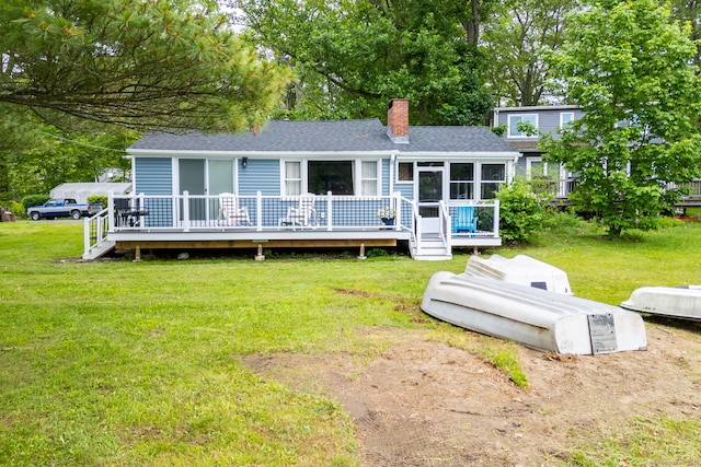 5 Lake Pt, Haddam, CT 06441 - view of front of property featuring a deck, a chimney, a shingled roof, and a front lawn