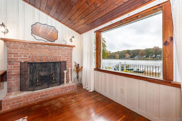 5 Lake Pt, Haddam, CT 06441 - unfurnished living room featuring wood-type flooring, a brick fireplace, wooden ceiling, lofted ceiling, and a water view