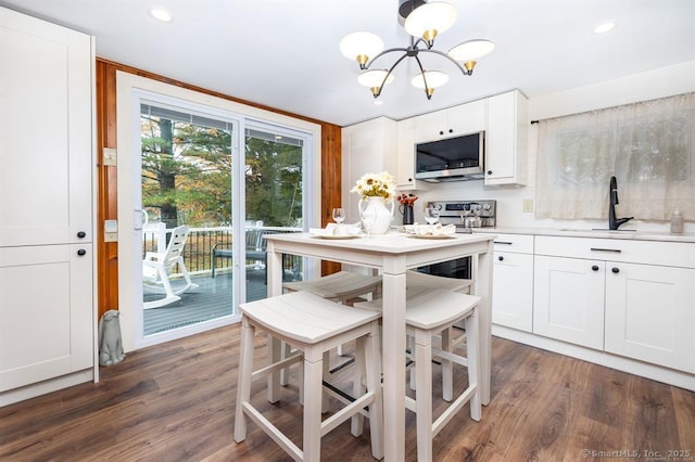 5 Lake Pt, Haddam, CT 06441 - kitchen featuring stainless steel microwave, a chandelier, dark wood-type flooring, light countertops, and recessed lighting