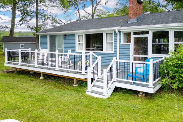 5 Lake Pt, Haddam, CT 06441 - rear view of house featuring a chimney, a shingled roof, a deck, and a lawn