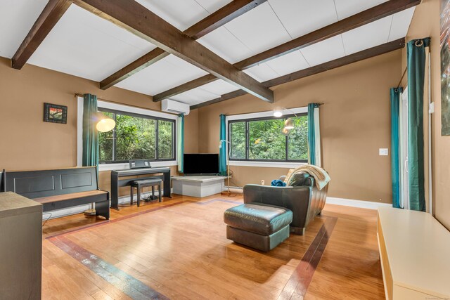 120 Highwoods Dr, Guilford, CT 06437 - living area featuring a wall mounted AC, hardwood / wood-style floors, and beam ceiling